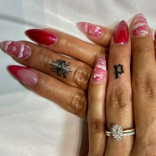 Old English Font Finger Tattoo