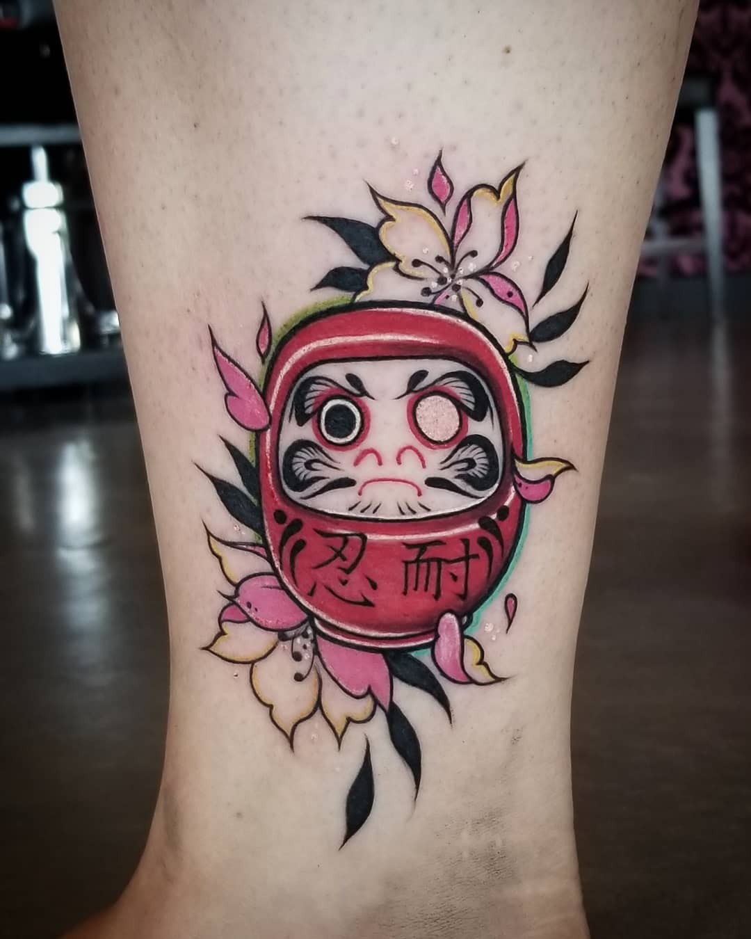 Daruma Doll Tattoos With Floral Motif