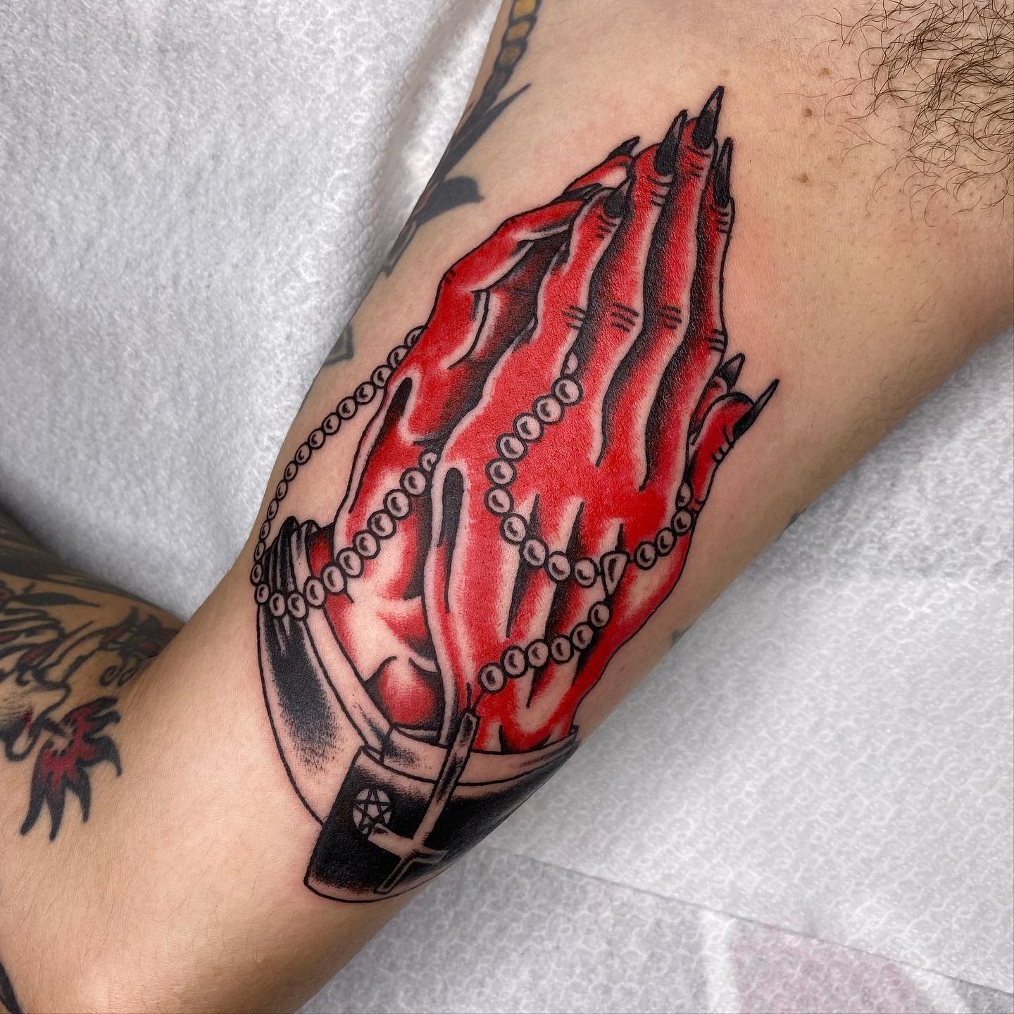 Rosary Beads Tattoo On Devil Hands