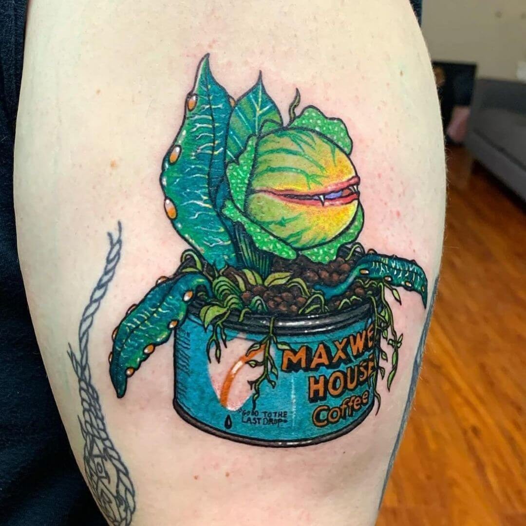 Grinning Audrey II Tattoo On Leg