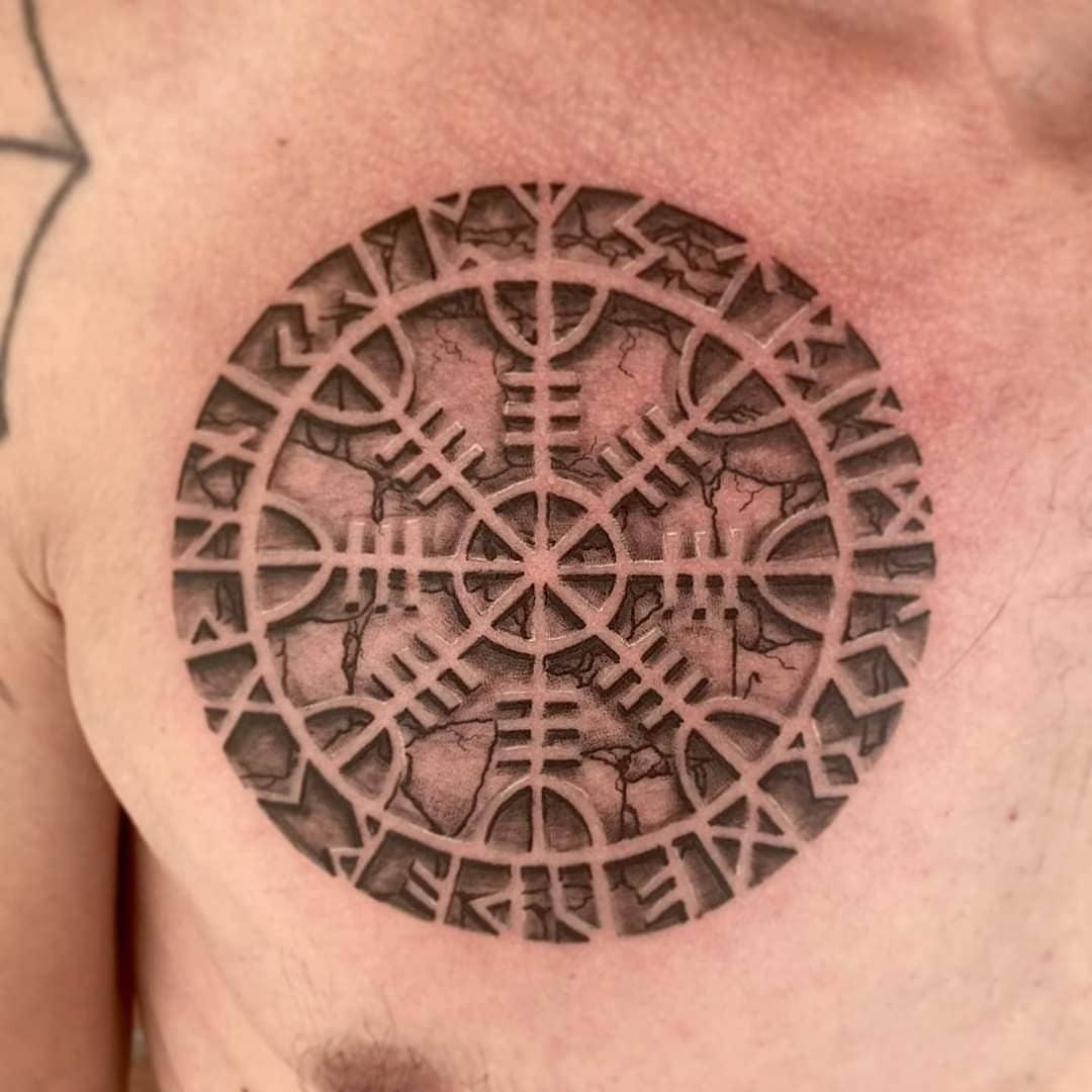 Cracked In Stone Helm Of Awe And Futhark Rune Symbol Realistic Tattoo On Chest