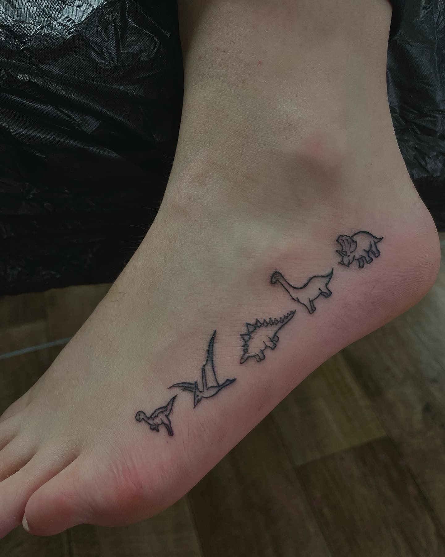 Miniature Dinosaur Tattoo