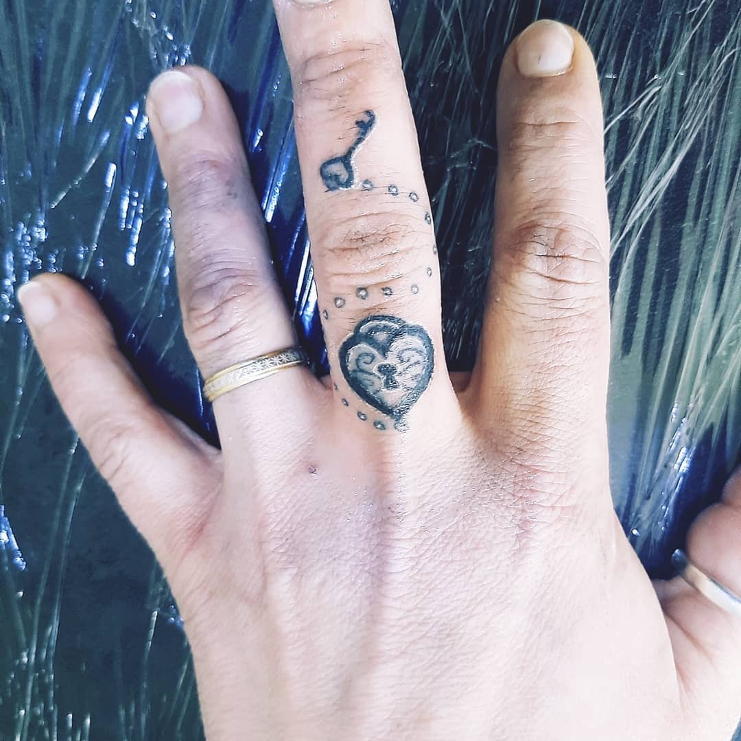 Unique Heart Finger Tattoo