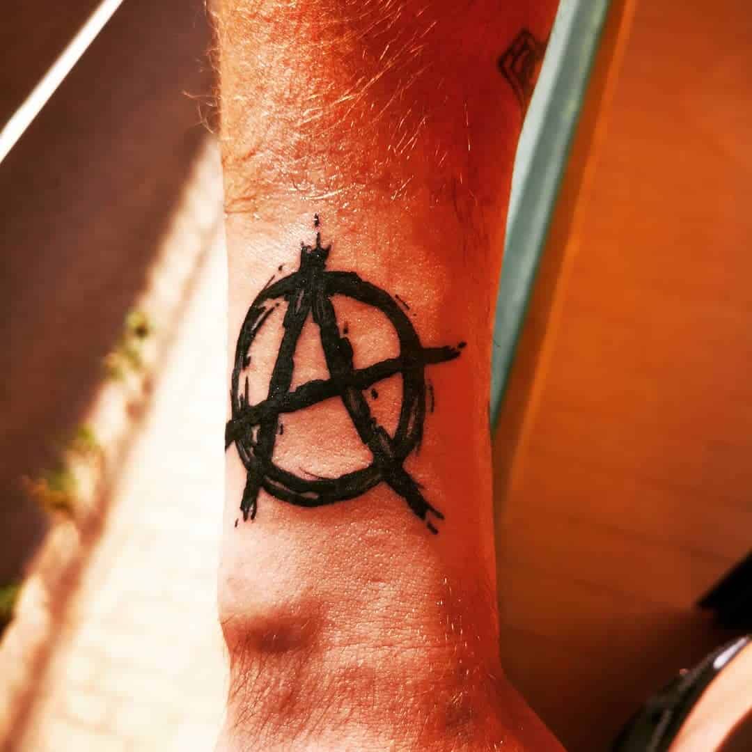 Simple Sketchy Anarchy Symbol Tattoo Idea Done In Black Ink Arm Placement