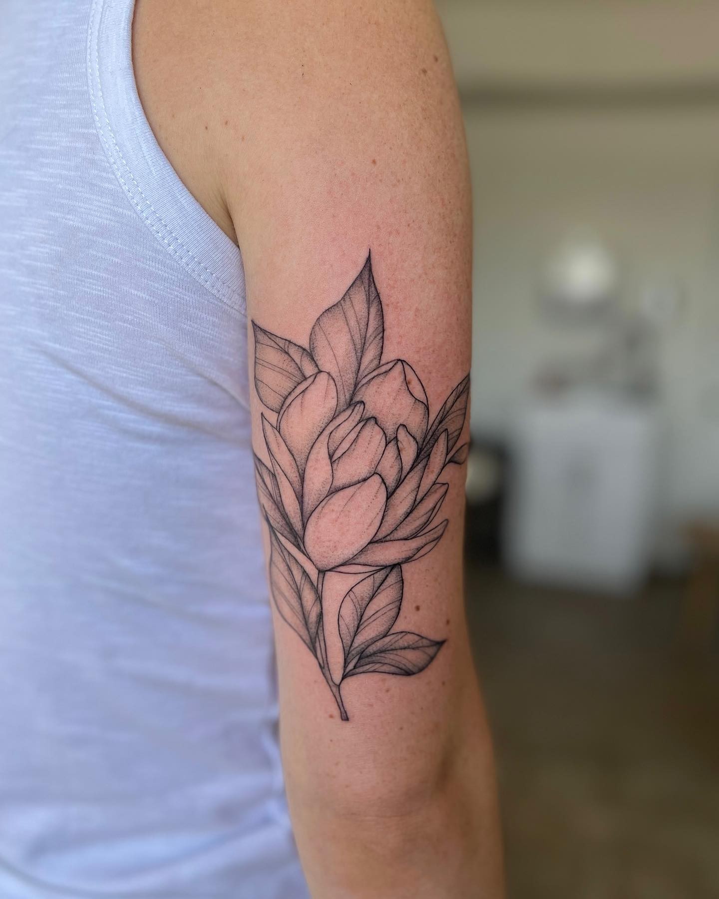 Delicate And Feminine Magnolia Tattoo Design For Women