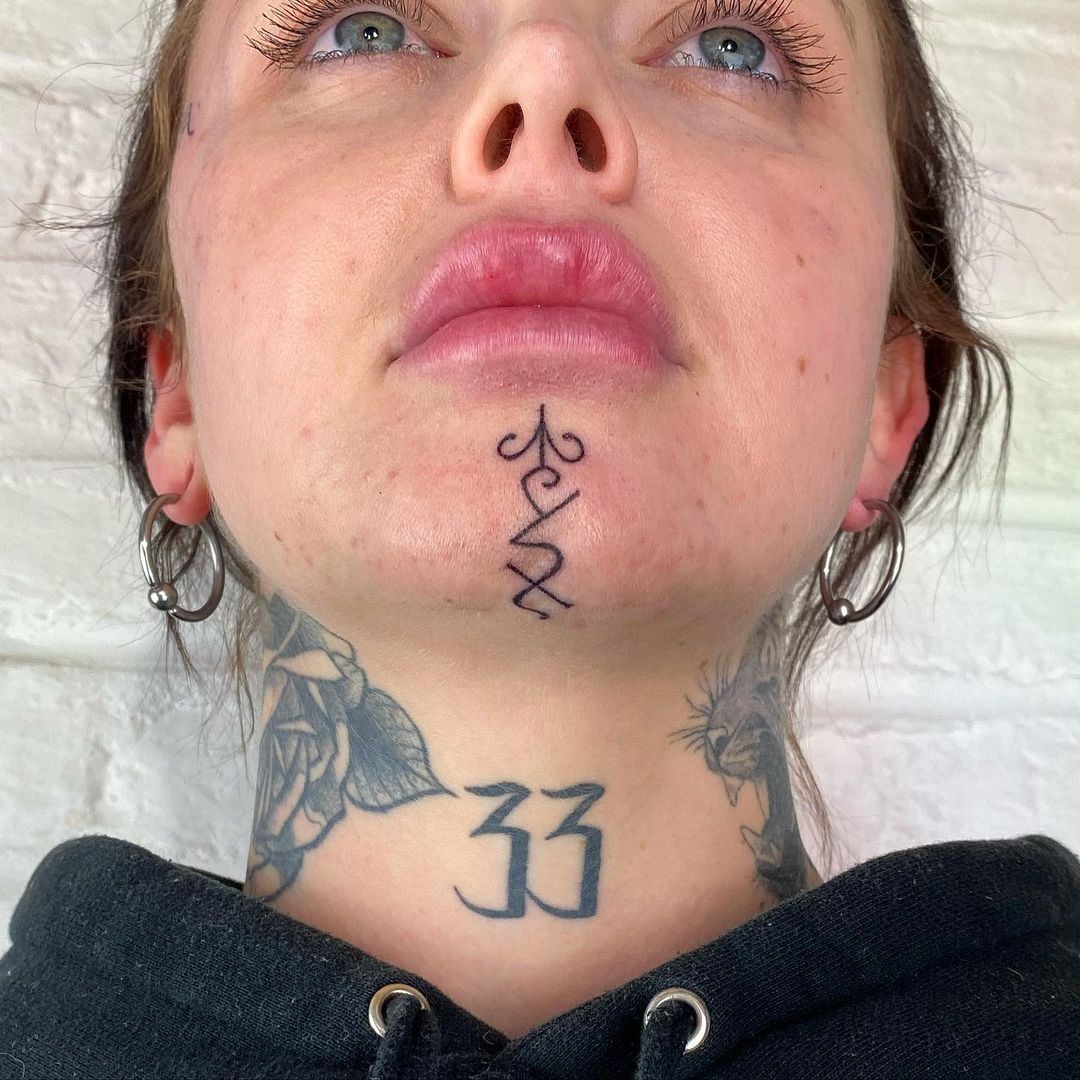 Minimalist Chin Tattoo