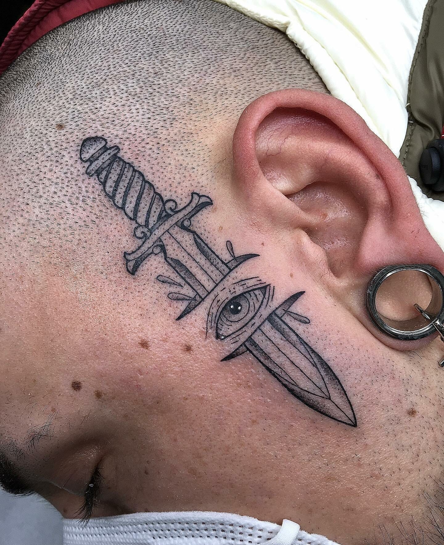 Knife Tattoo Design Piercing Through Skin