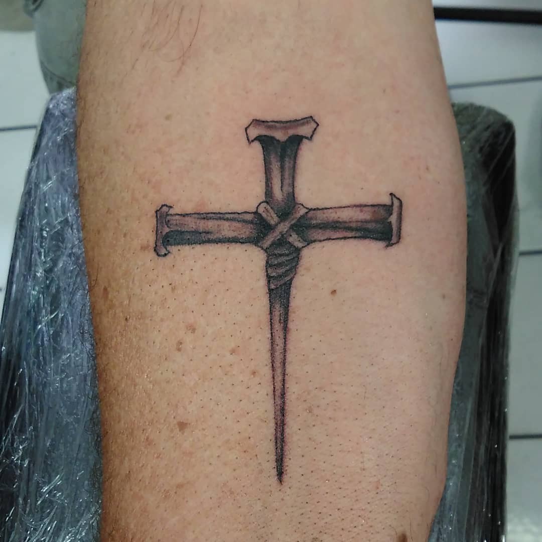 Transparent Simple Nail Cross Tattoo Idea