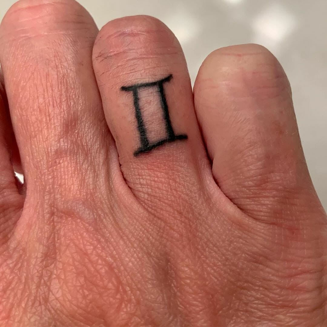 Gemini Symbols On Finger Tattoo