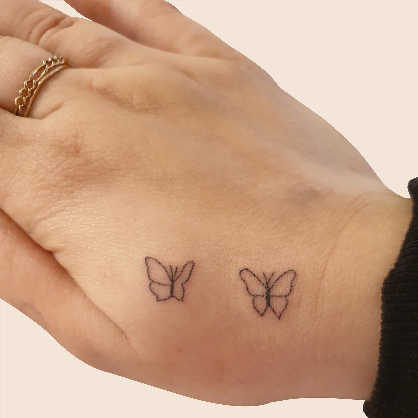 Small Butterfly Hand Tattoo