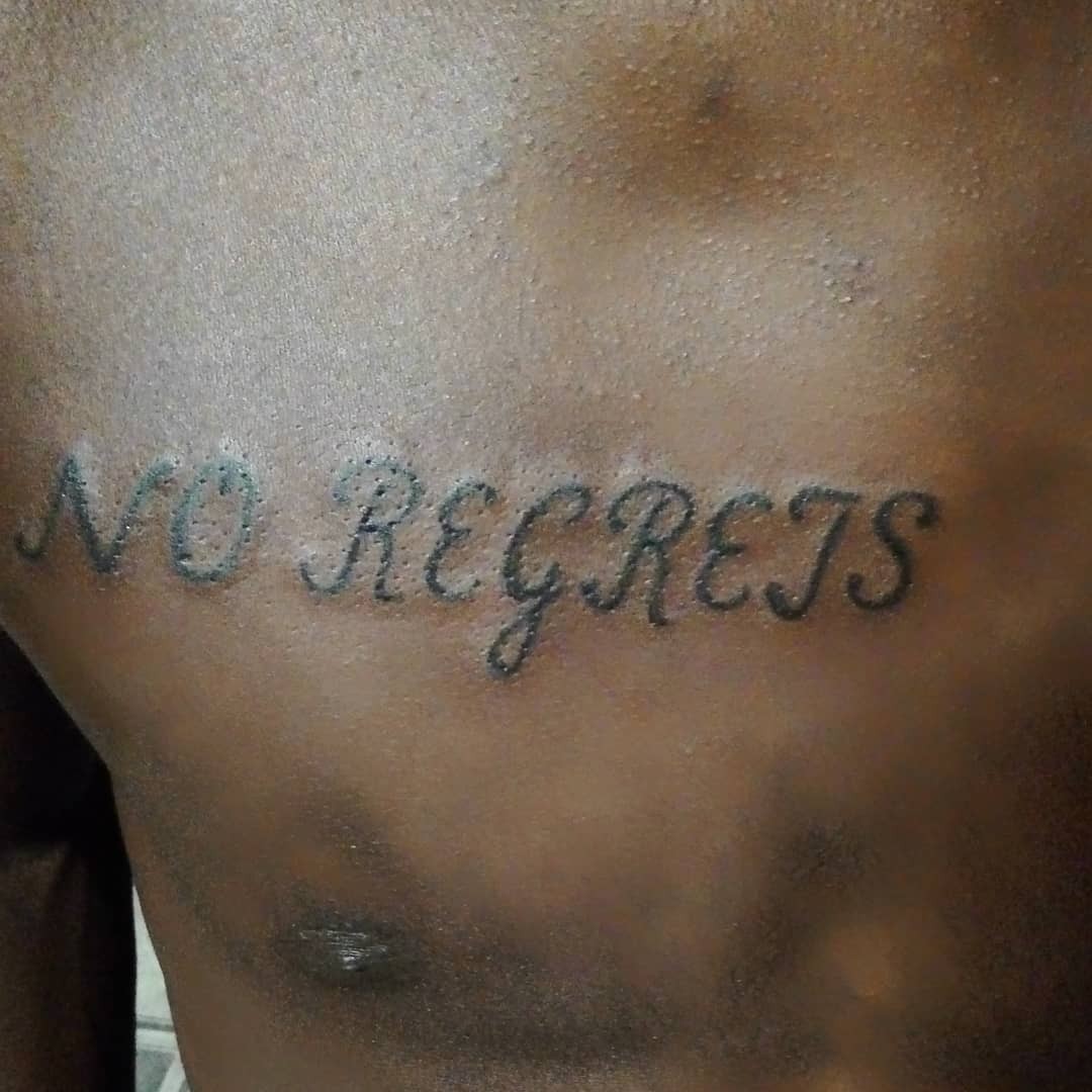 We’re The Millers No Regrets Tattoo On Chest In Black Ink Funny Movie Inspired Tattoos