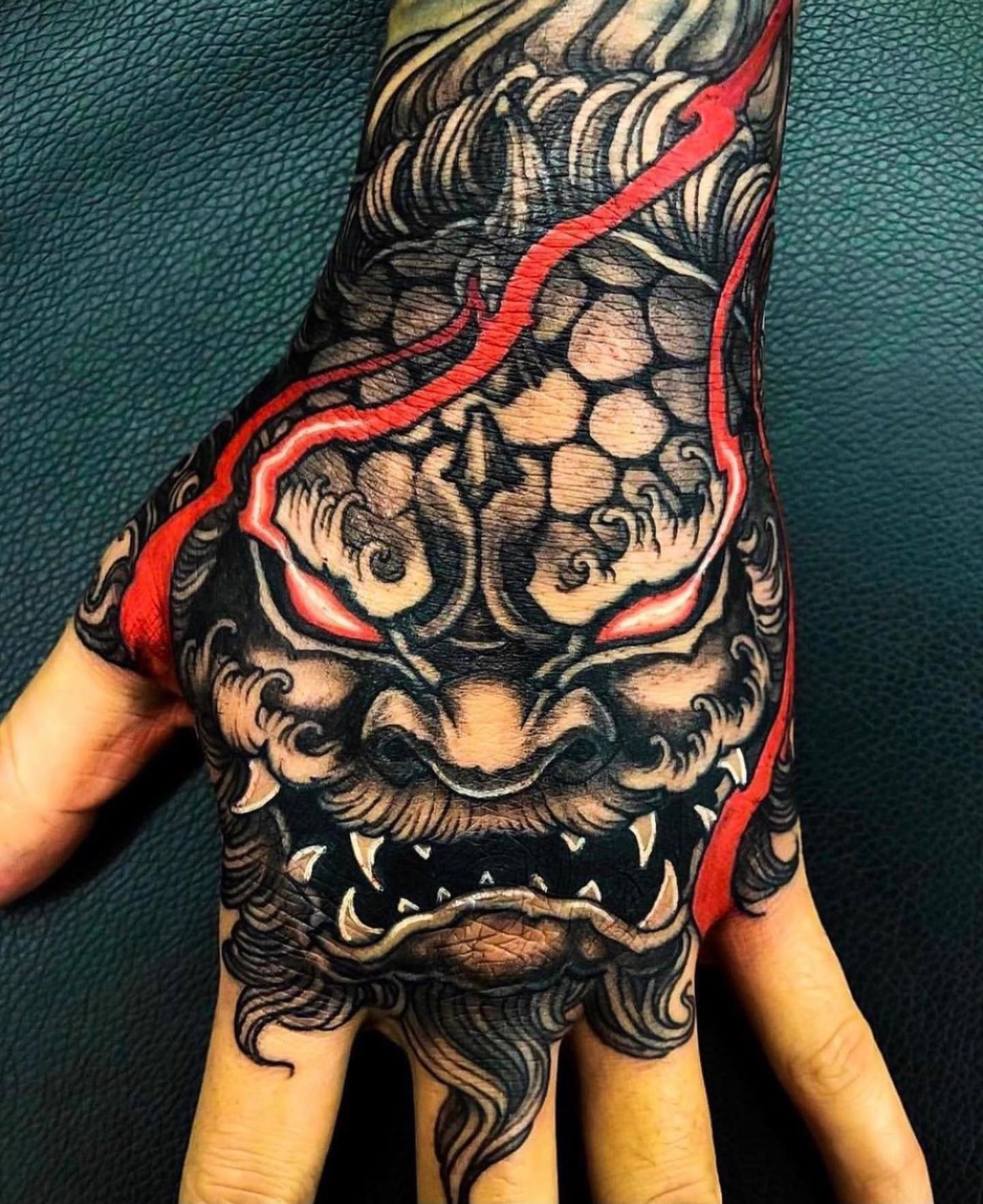 Traditional Japanese Foo Dog Tattoo Designs On Hand