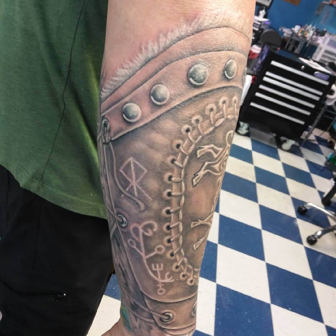 Evocative Half Sleeve Armor Tattoo Designs