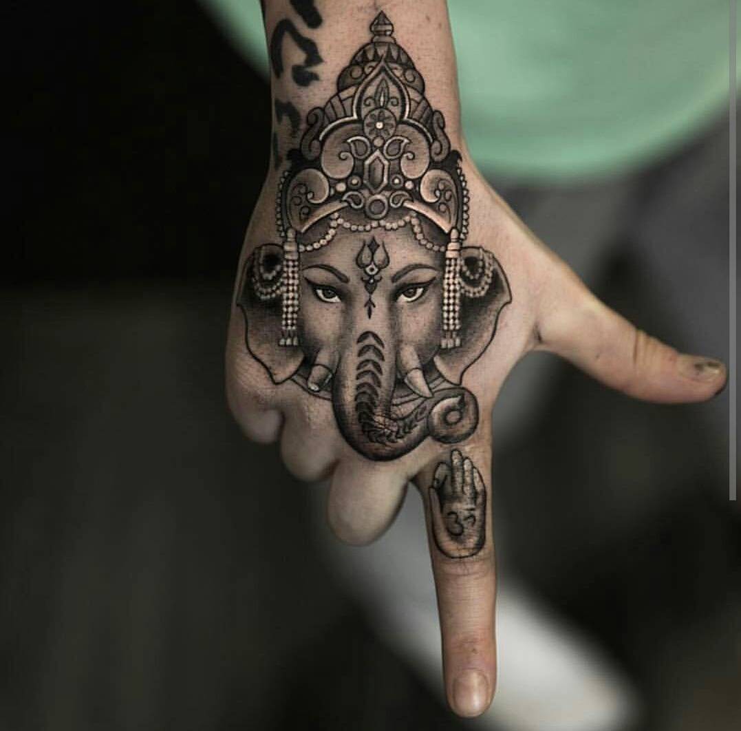 Ganesha Tattoo Designs On Fist