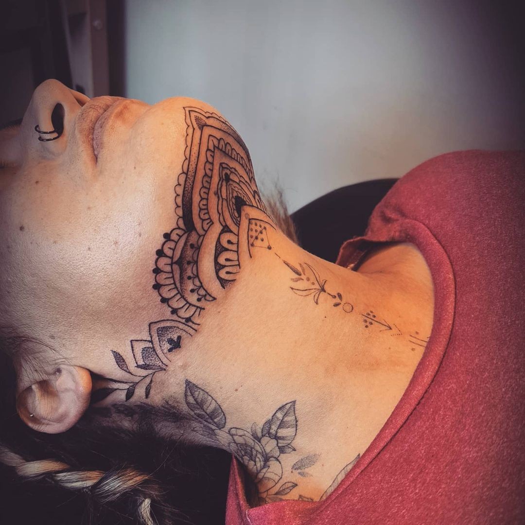 Elaborate Chin And Neck Tattoo