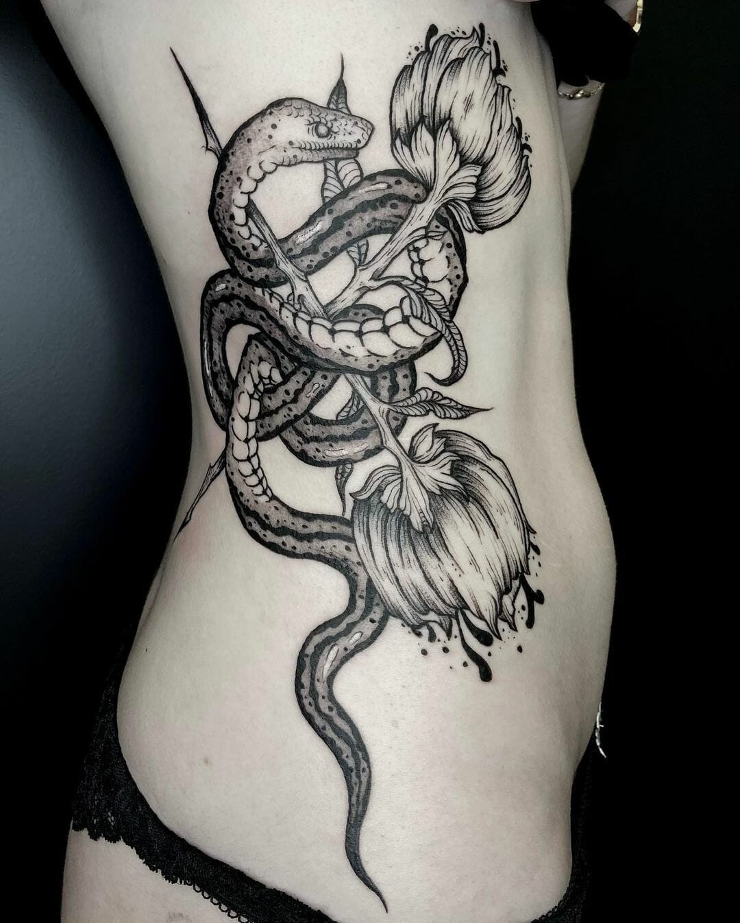 The Snake Intertwined In Rose Tattoo