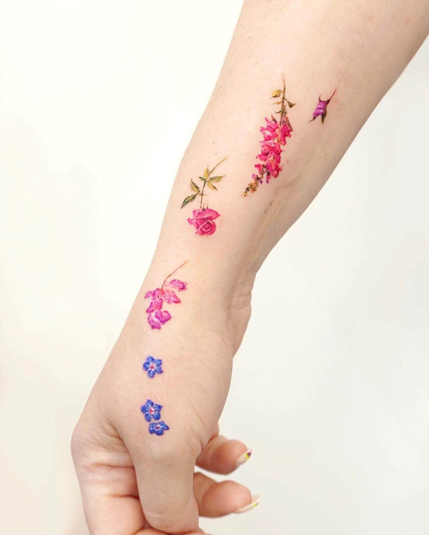 Bunch of Suspended Flower Wrist Tattoo Ideas