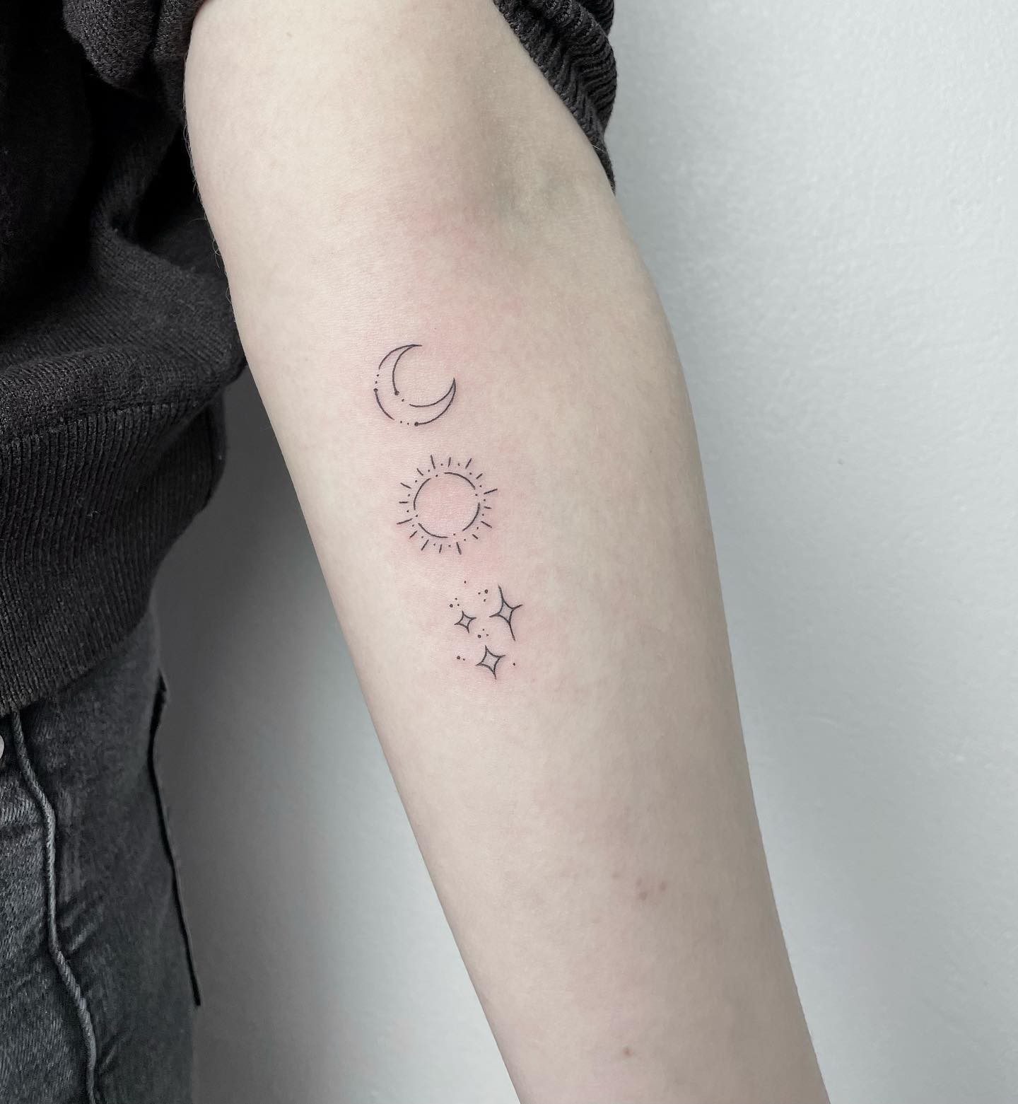 Minimalist Sun and Moon tattoo