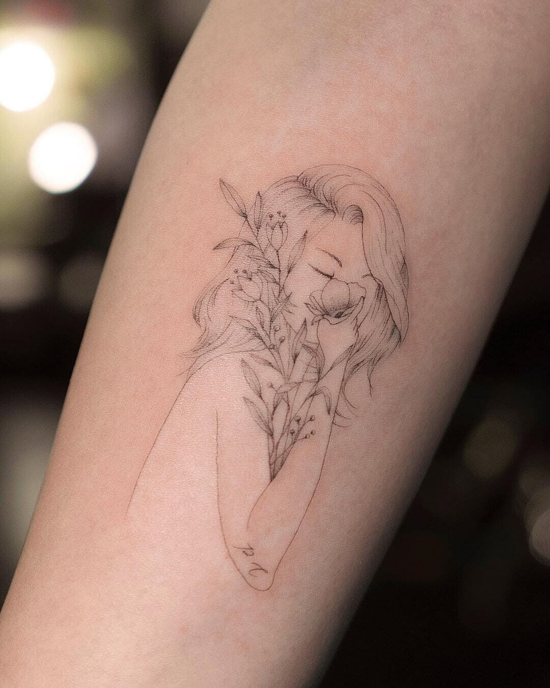 The Girl and Flowers Minimalist Tattoo