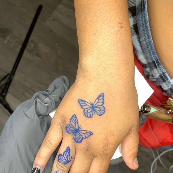 Blue Butterfly Hand Tattoo