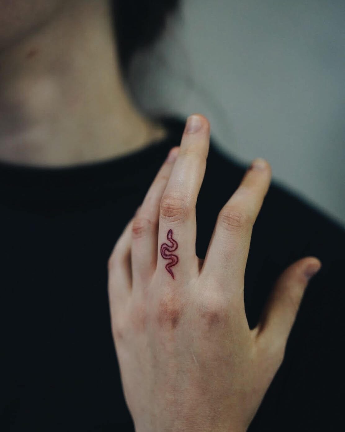 Minimalistic Black Lined Red Snake Tattoo