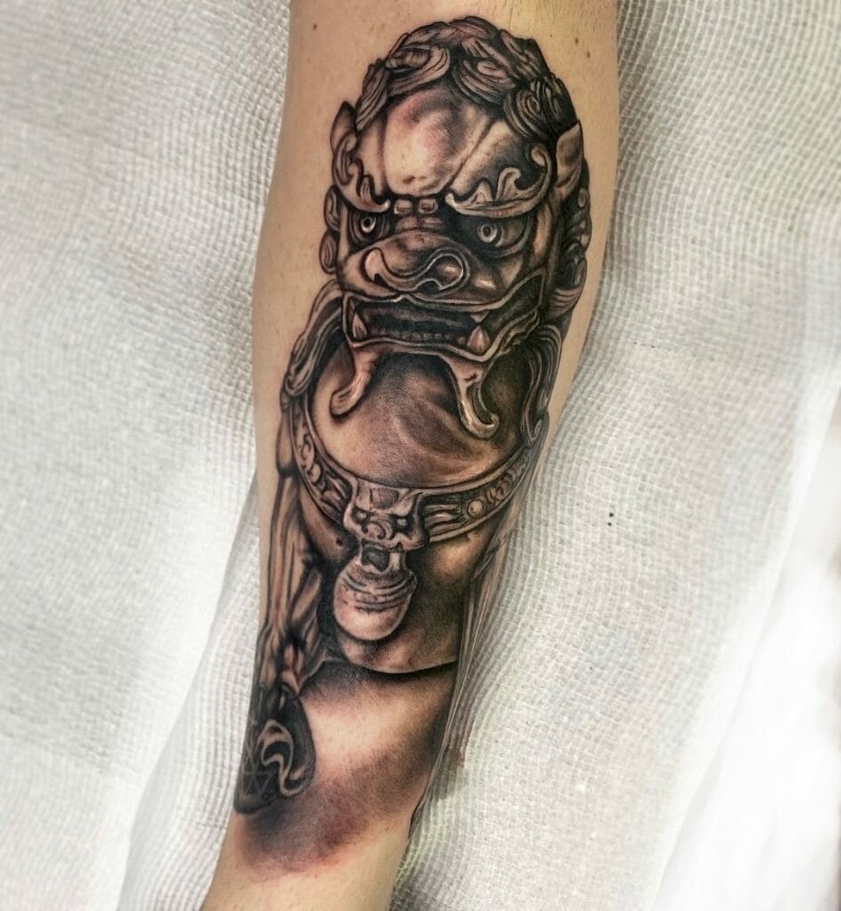 Black And Grey Statue Tattoo