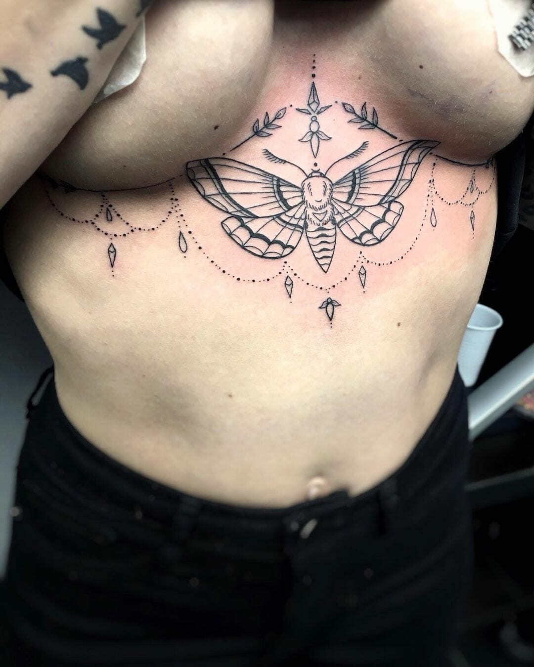 Simple Female Sternum Tattoo Moth