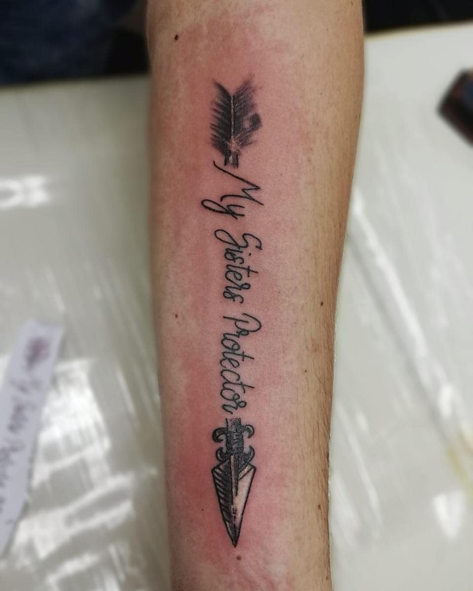 Arrow Lettered Tattoo