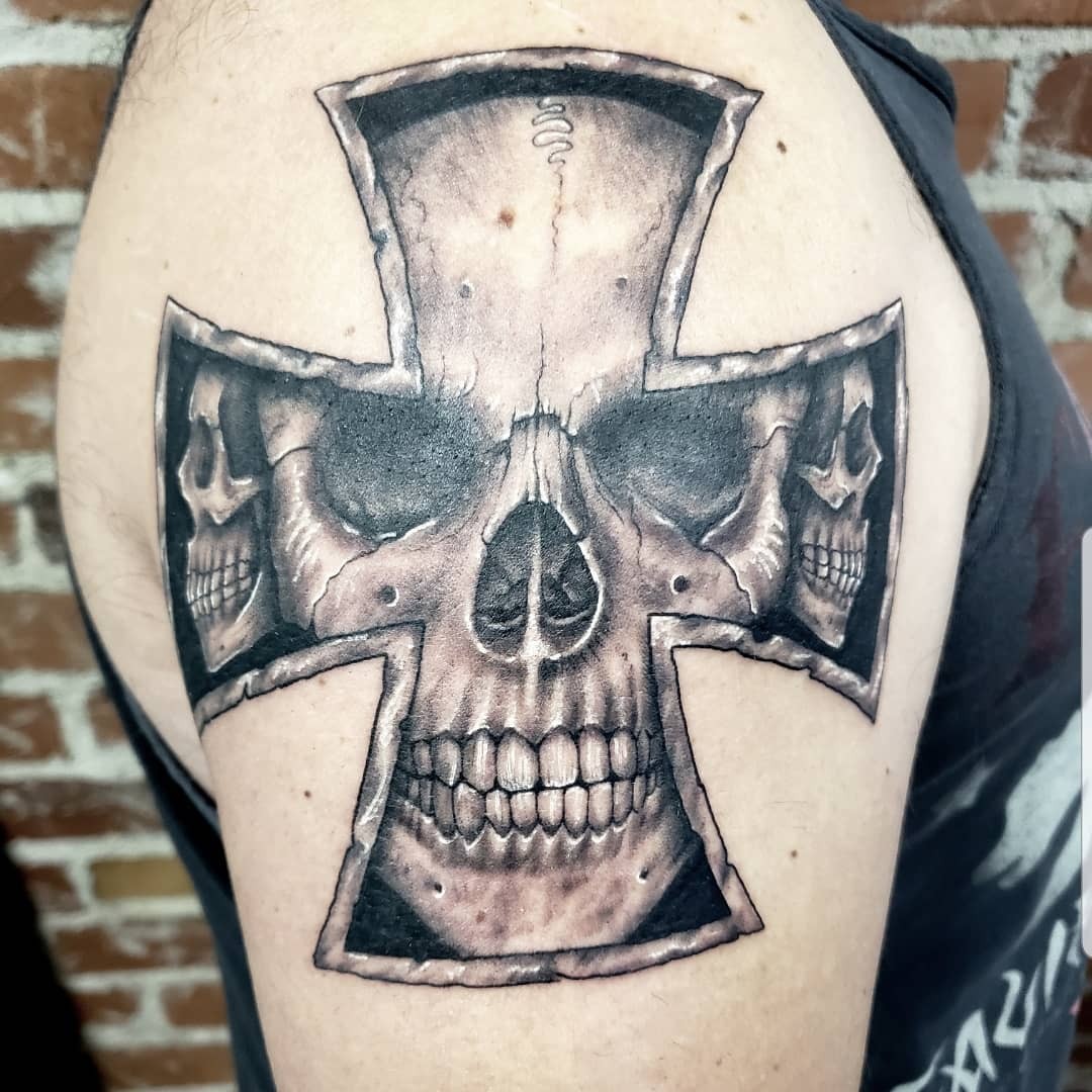 A Skull Tattoo Inside A Roman Cross