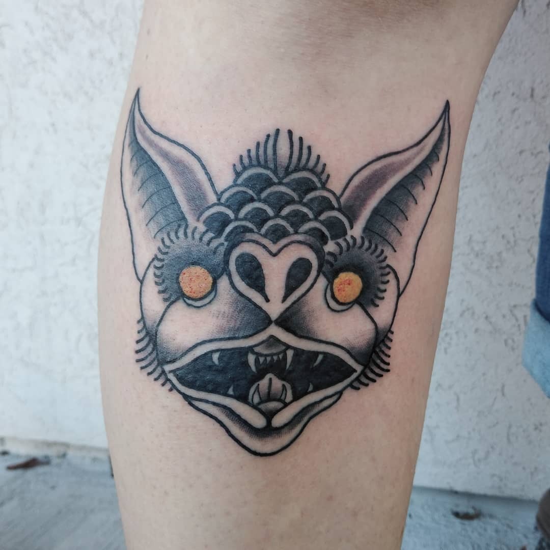 Black Monochromatic Tattoo Of A Bat Head