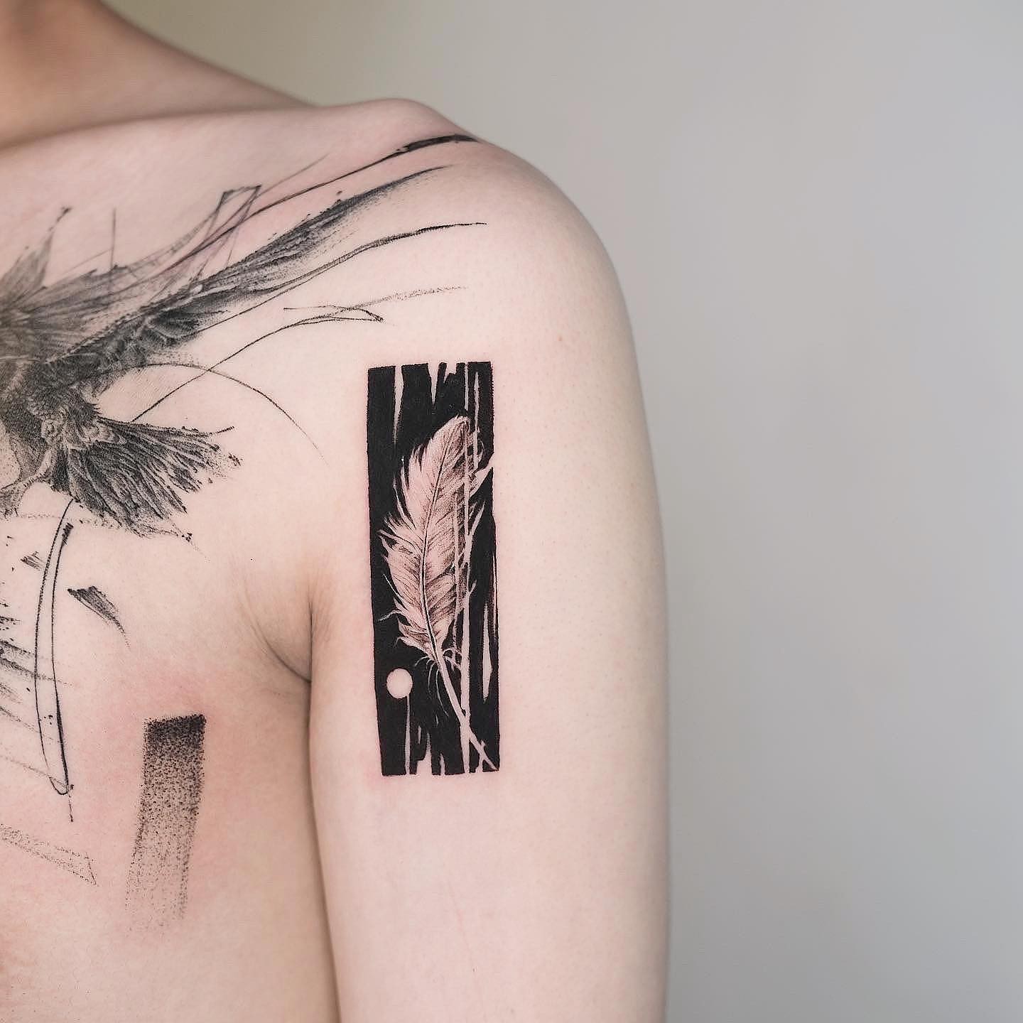 Feather-themed Rectangle Tattoo Design