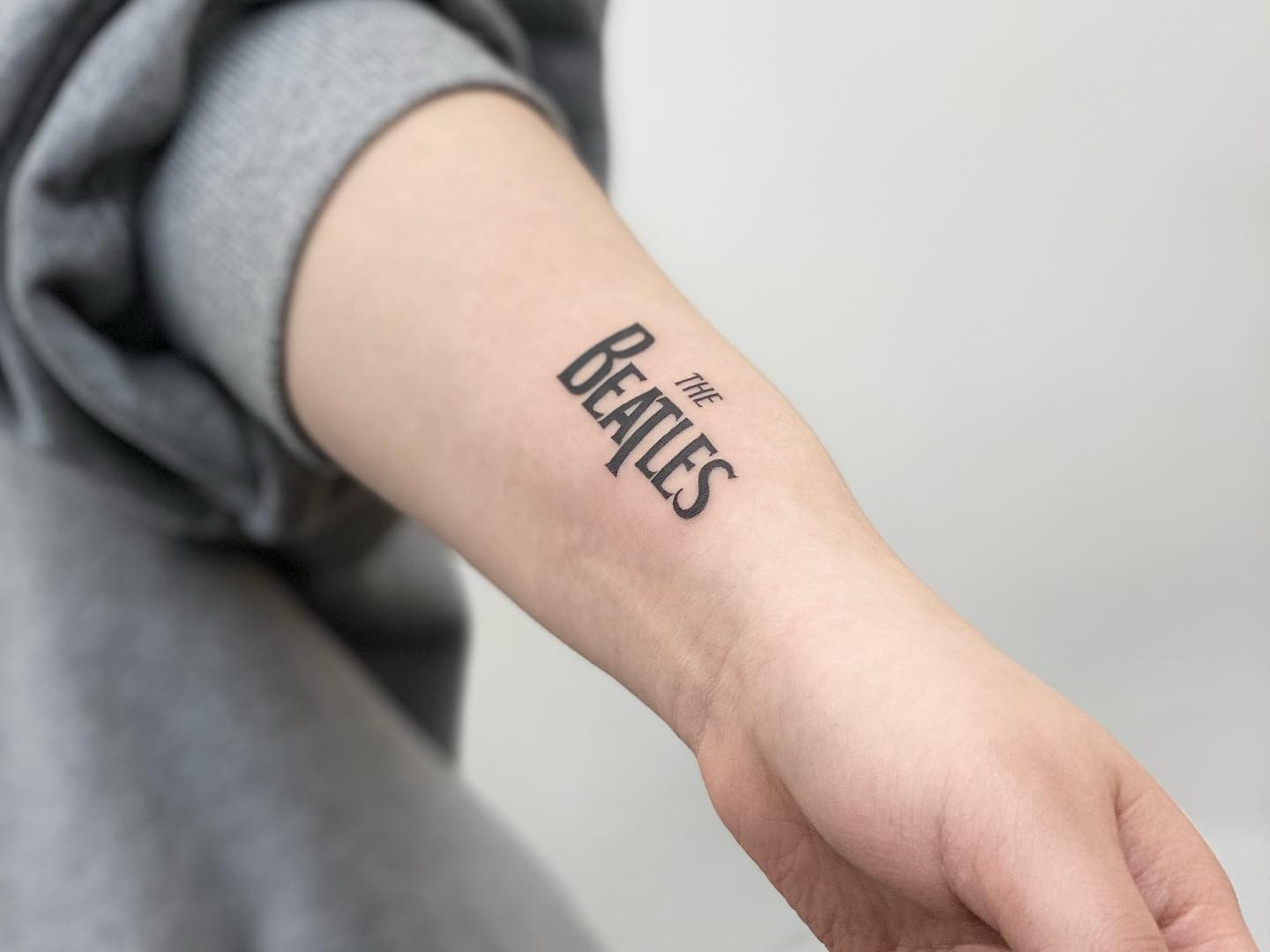 Single Word Script Font Tattoo