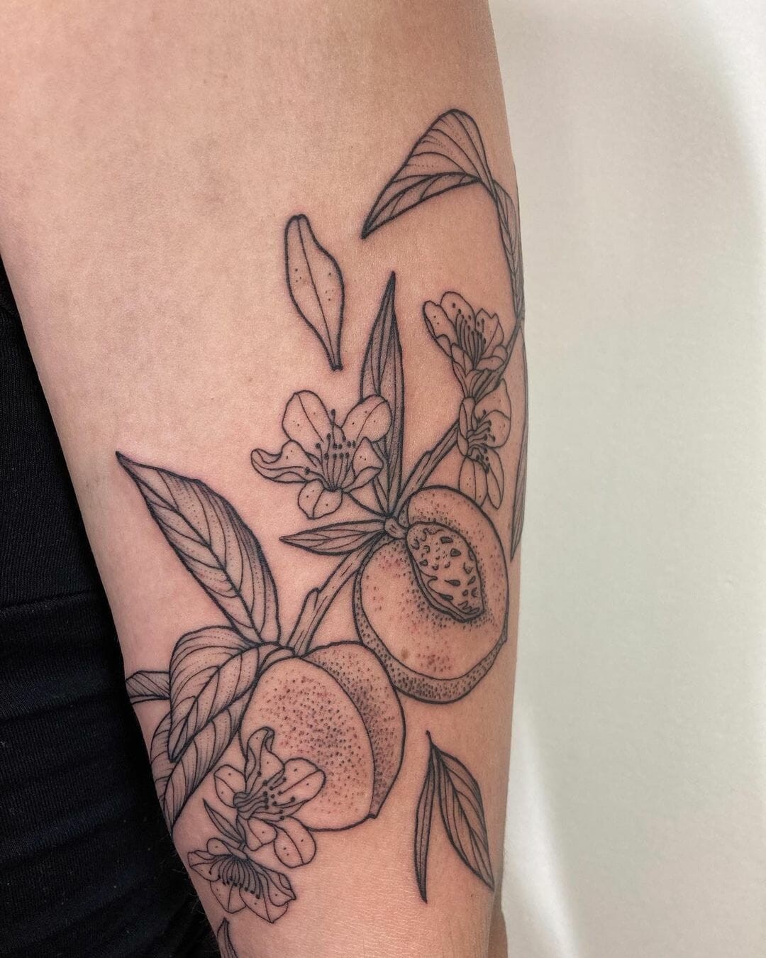 Blossoming Flowers And Peach Tattoo