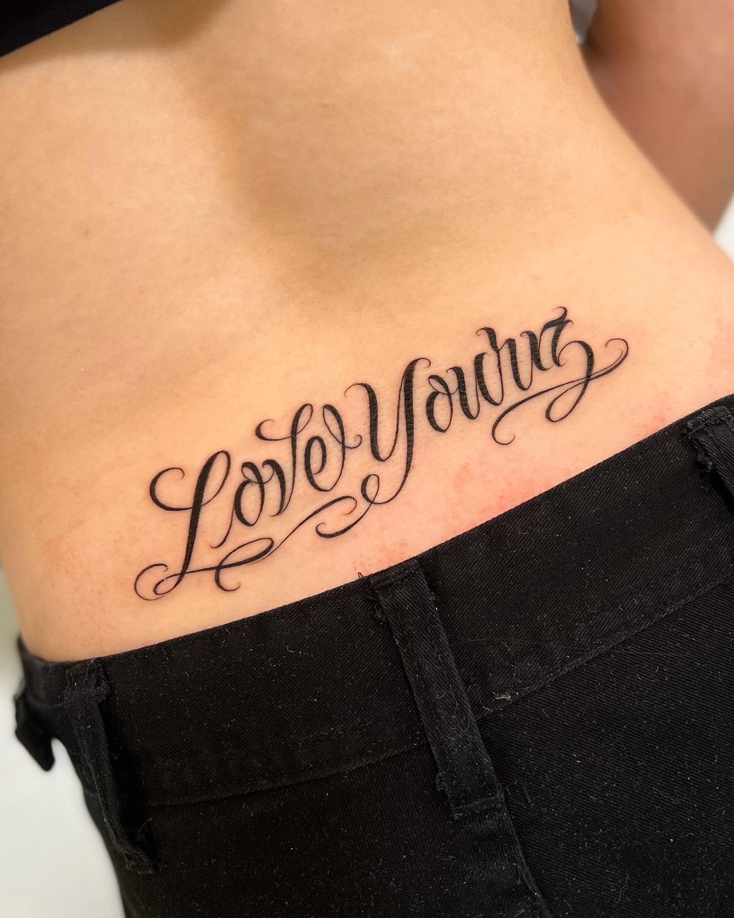 Script Lower Back Tattoo