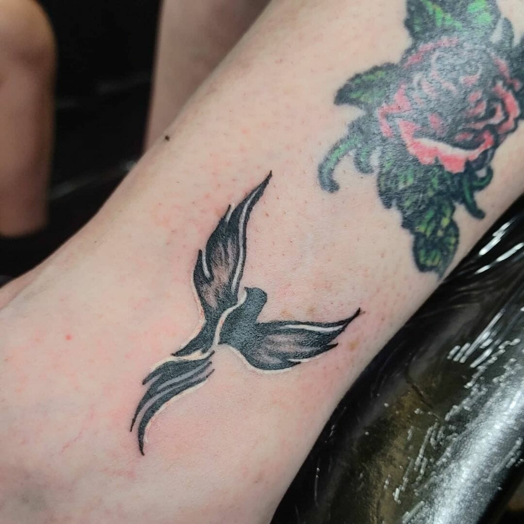 Single Bird Silhouette Tattoo