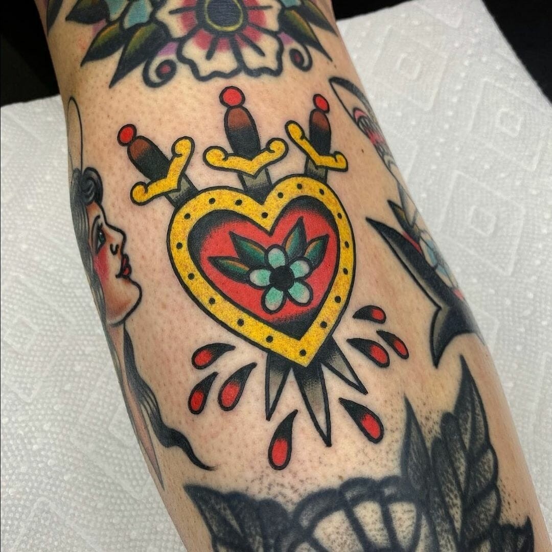 Shielded Heart And Swords Tattoo