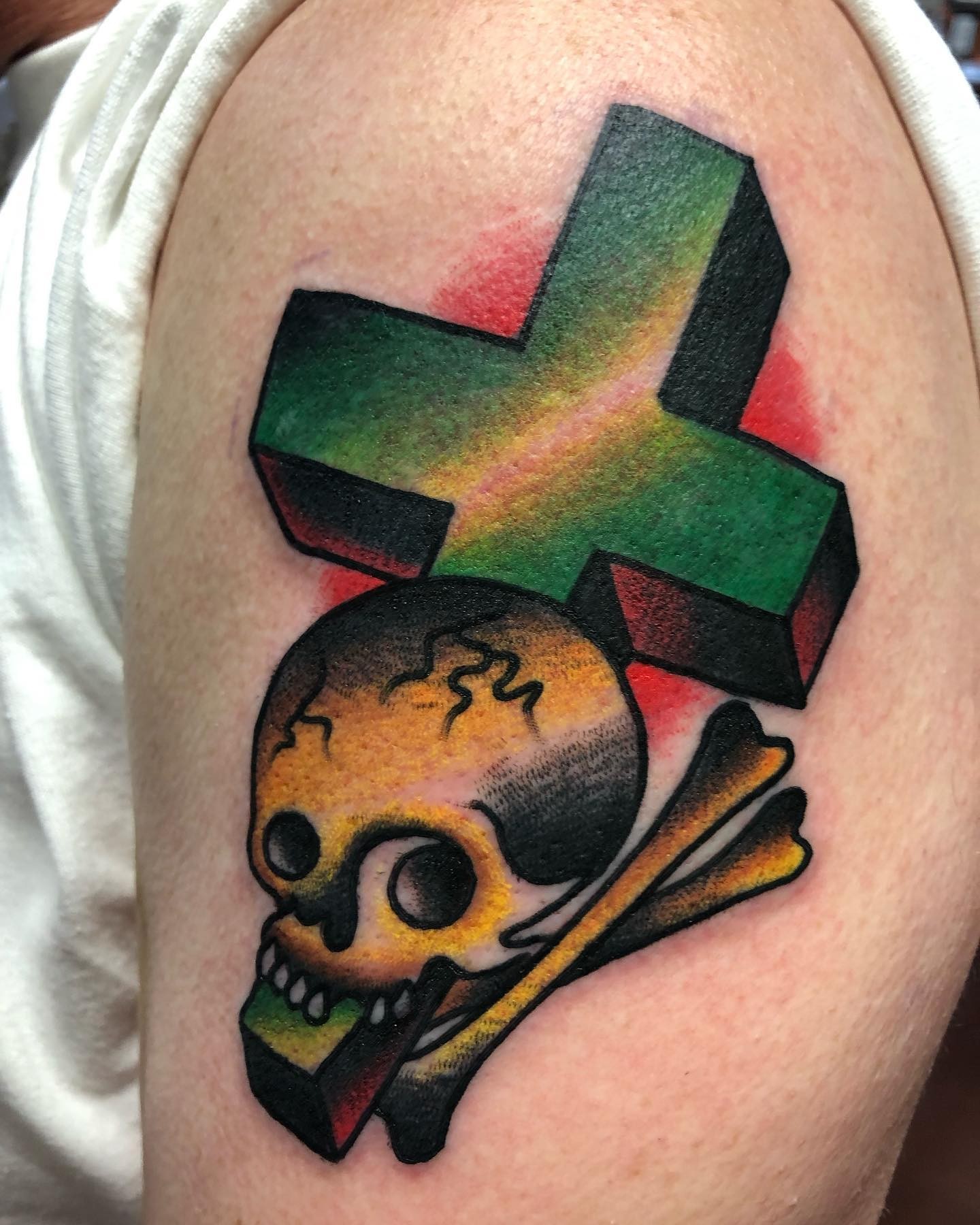 An Artistic Skull And Cross Bones Tattoo