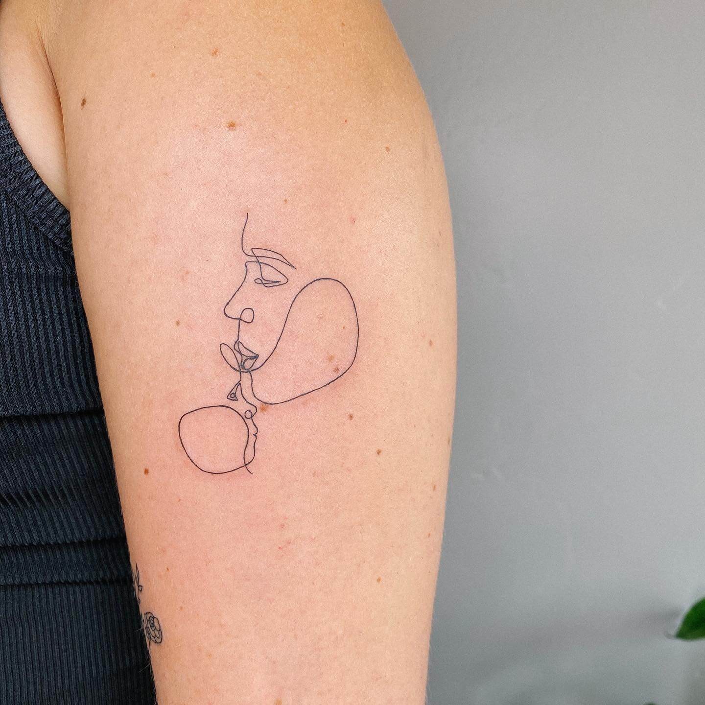 Minimalist Design Fine Line Tattoo Of Mother And Child