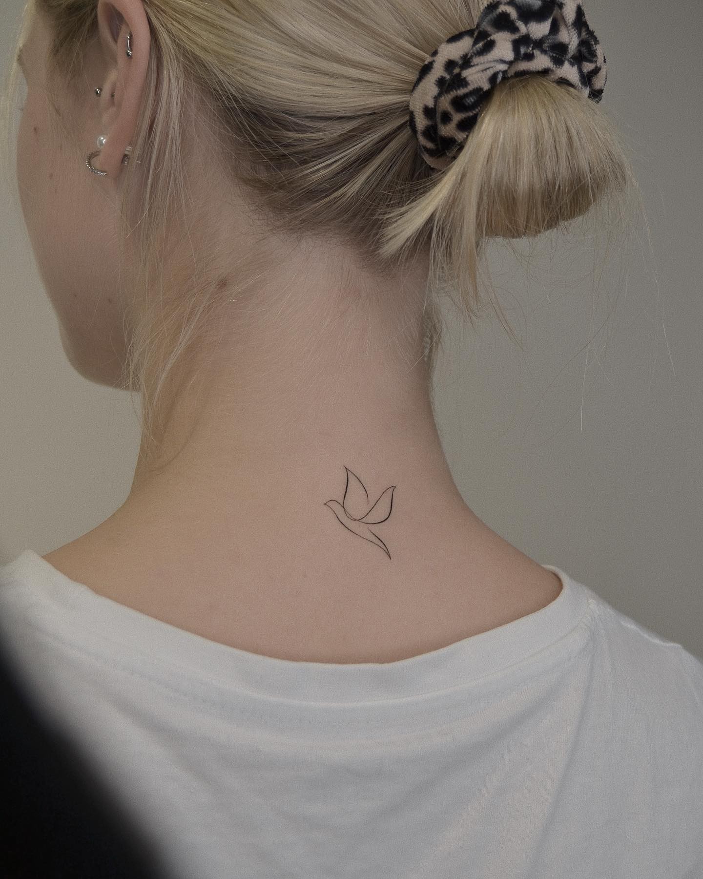 Small Size Tatoo Dove On Neck