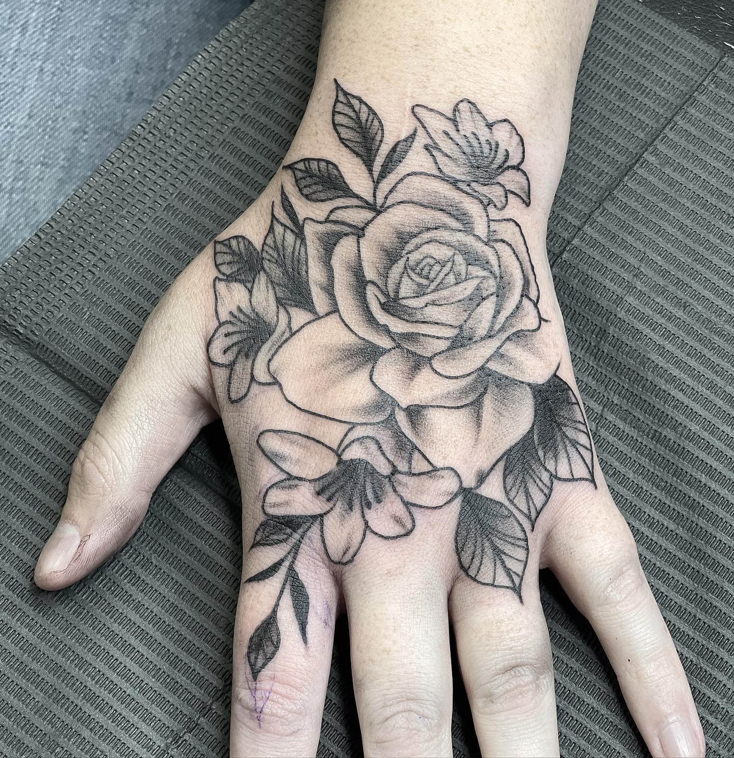 Beautiful Embossed Black Rose Hand Tattoo