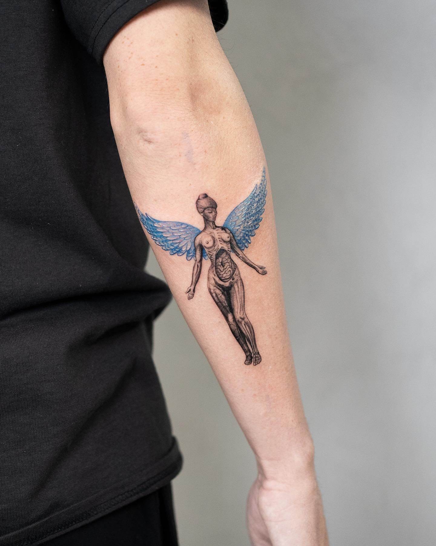 In Utero Blue Wings Tattoo