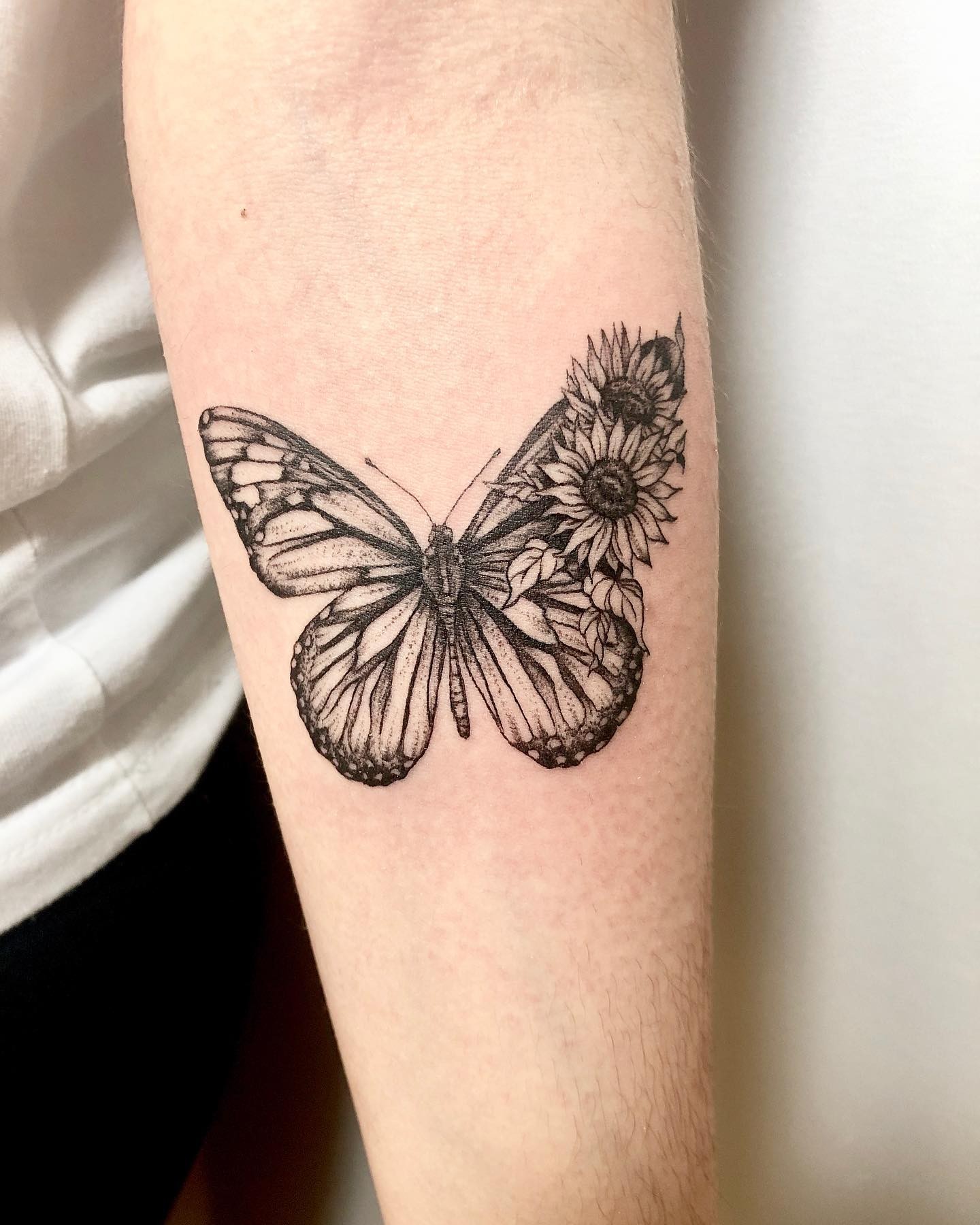 Cute Butterfly With Two Flowers Tattoo