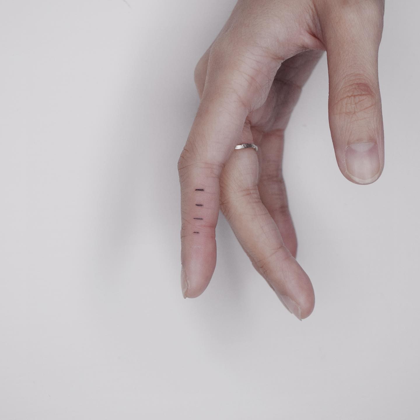 Simple Four Lines Minimalist Finger Tattoo