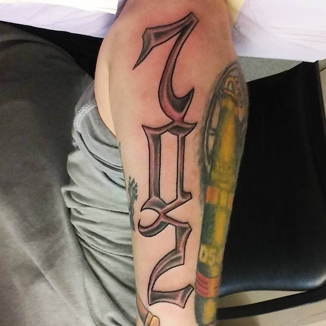 Upper Elbow Area Code Tattoo