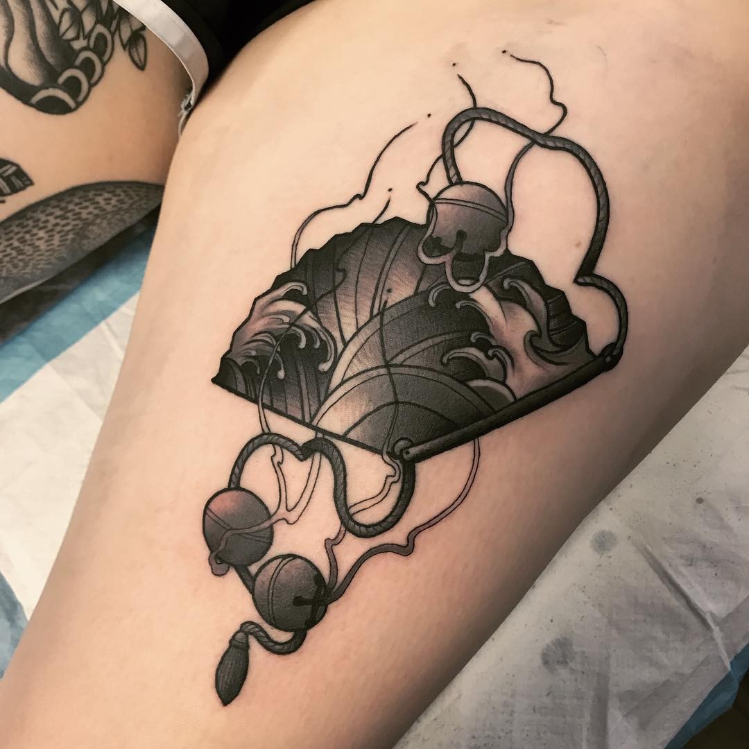 Dark Themed Fan Tattoo With Bells