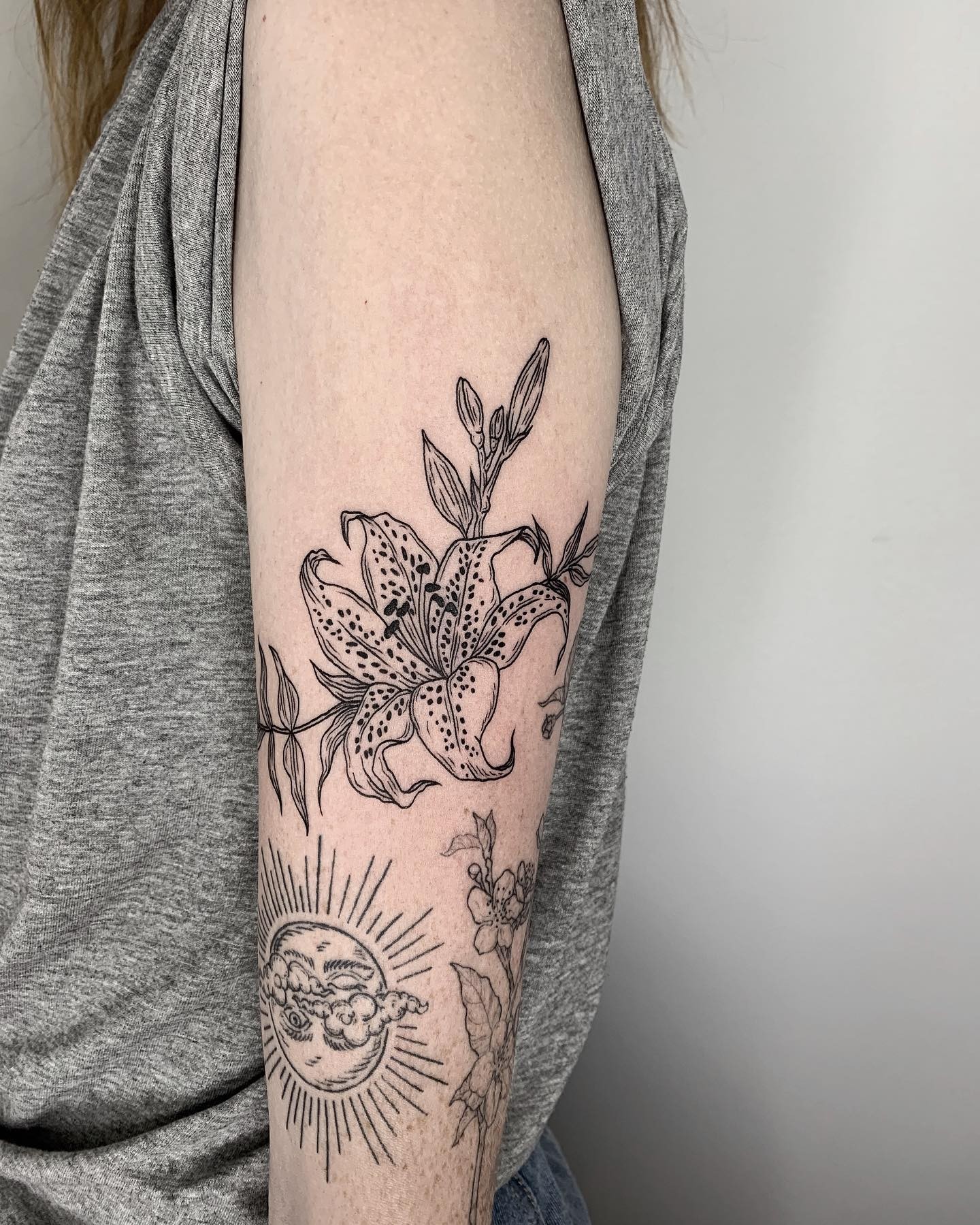 A Simple Blackwork Tiger Lily Tattoo