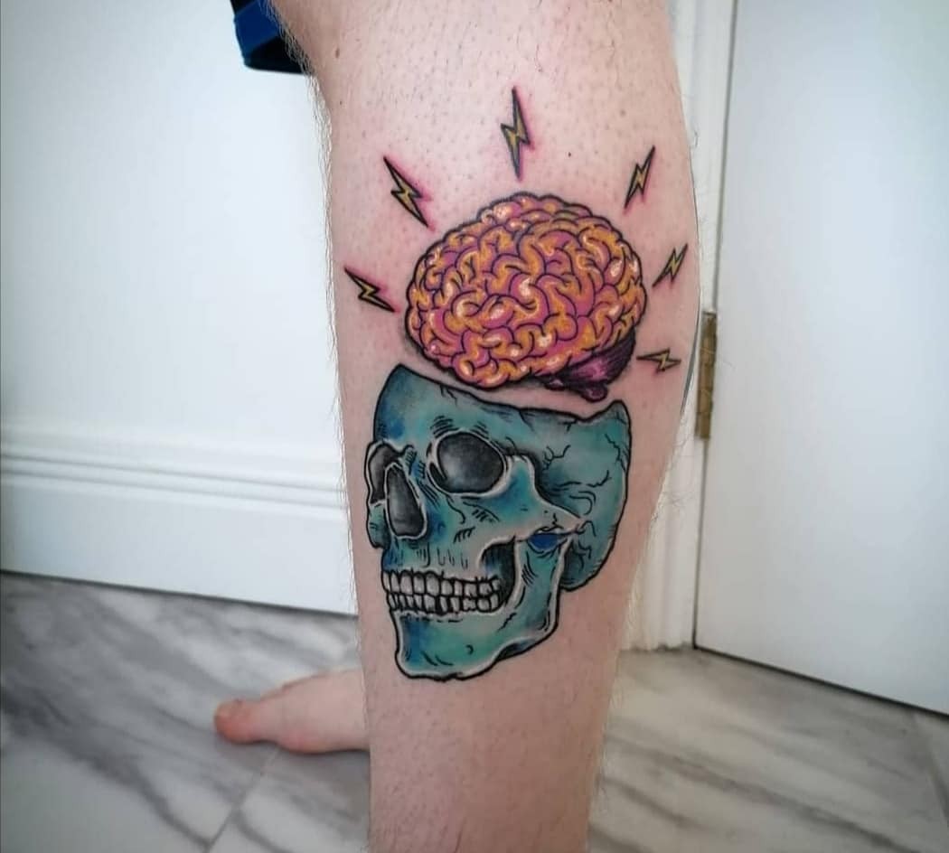 Brain Emerging Out Of A Skull Tattoo