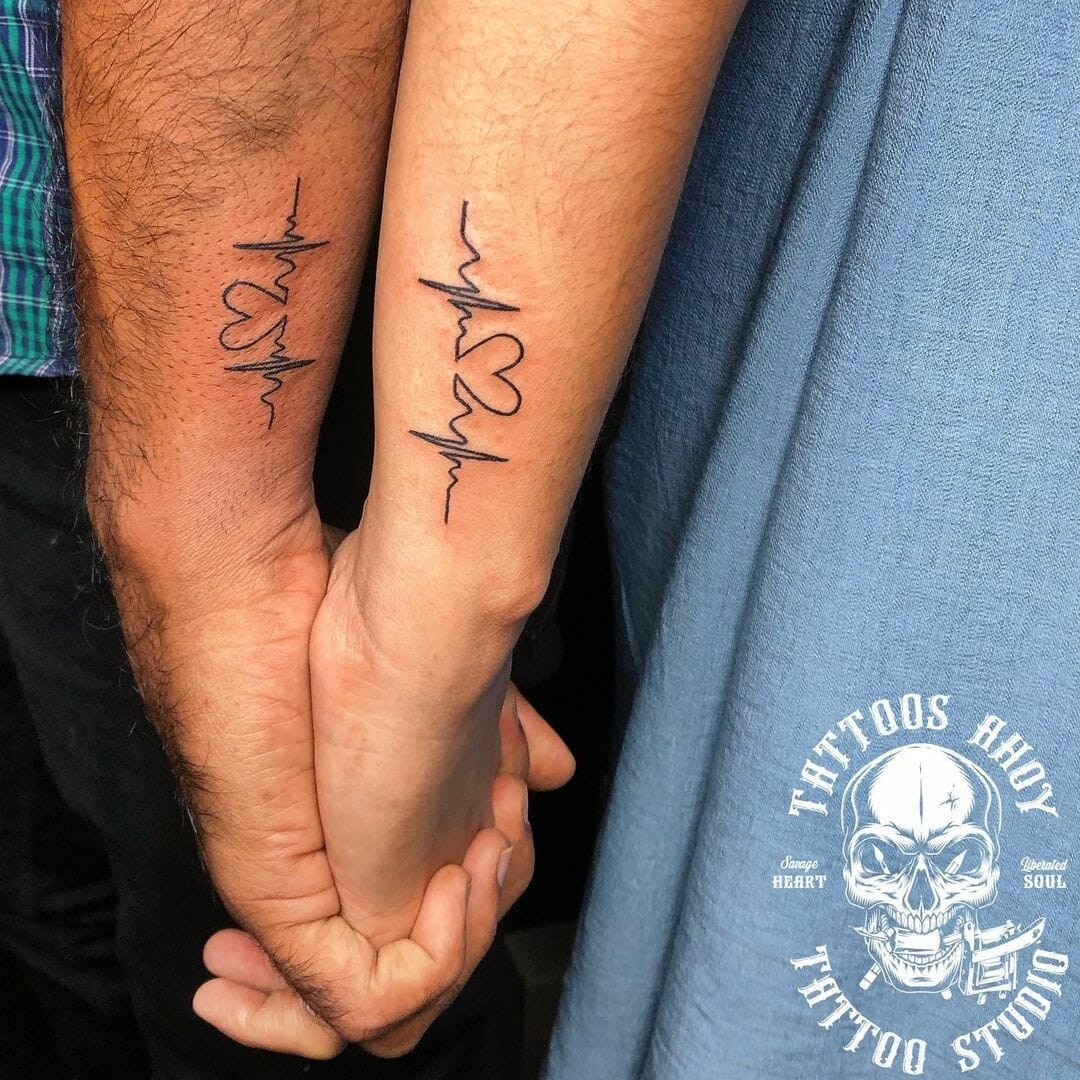 A Loving Couple Heartbeat Tattoo Designs