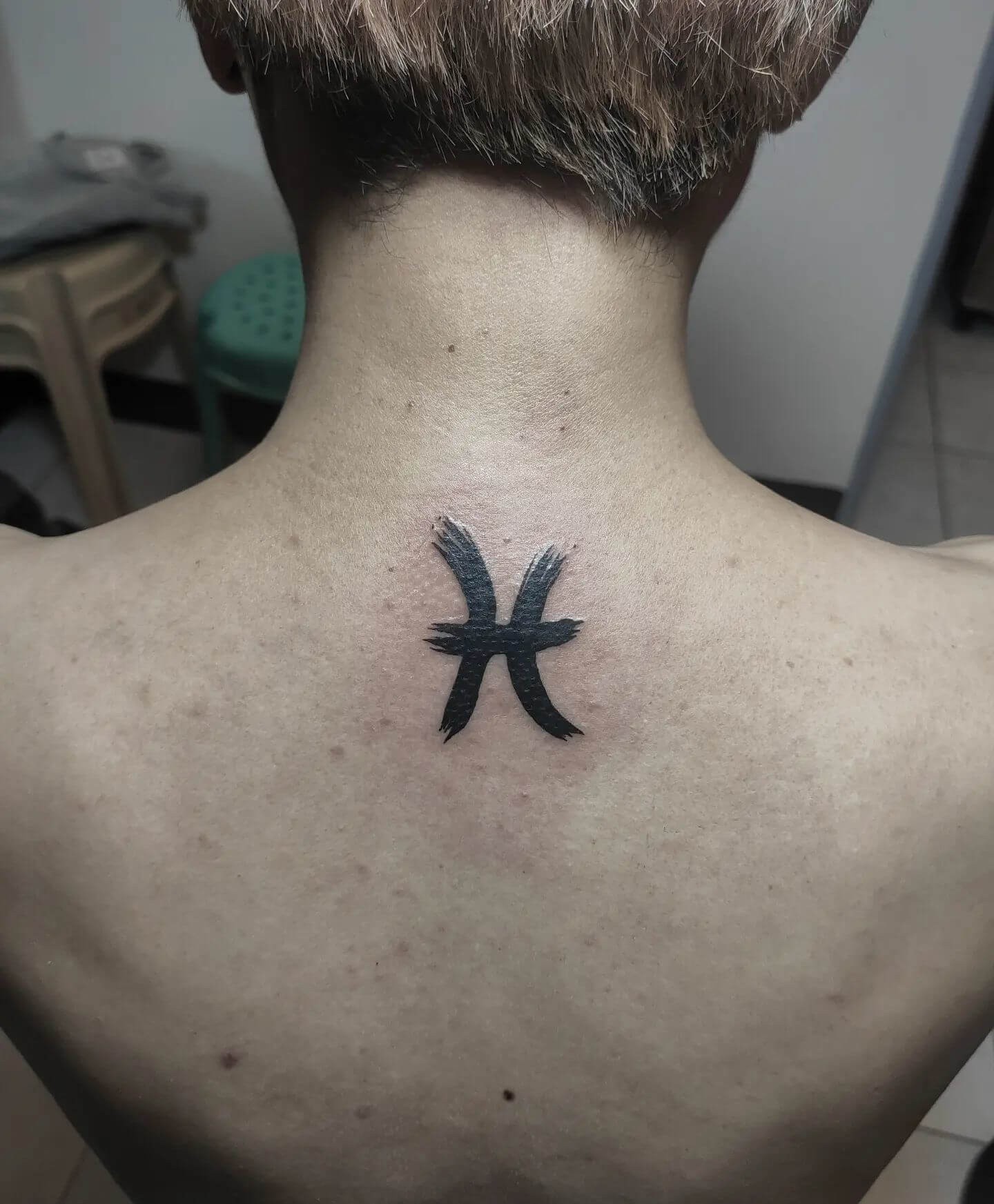 Minimal Design Pisces Tattoo For Men On Back