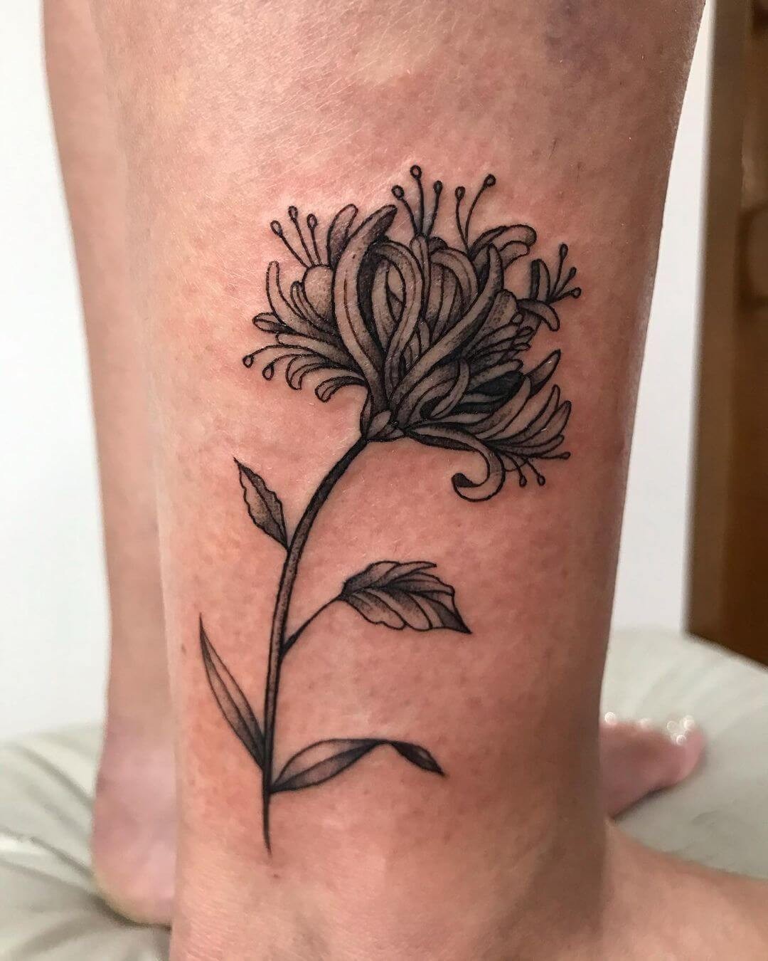 Black Ink Flower Tattoo